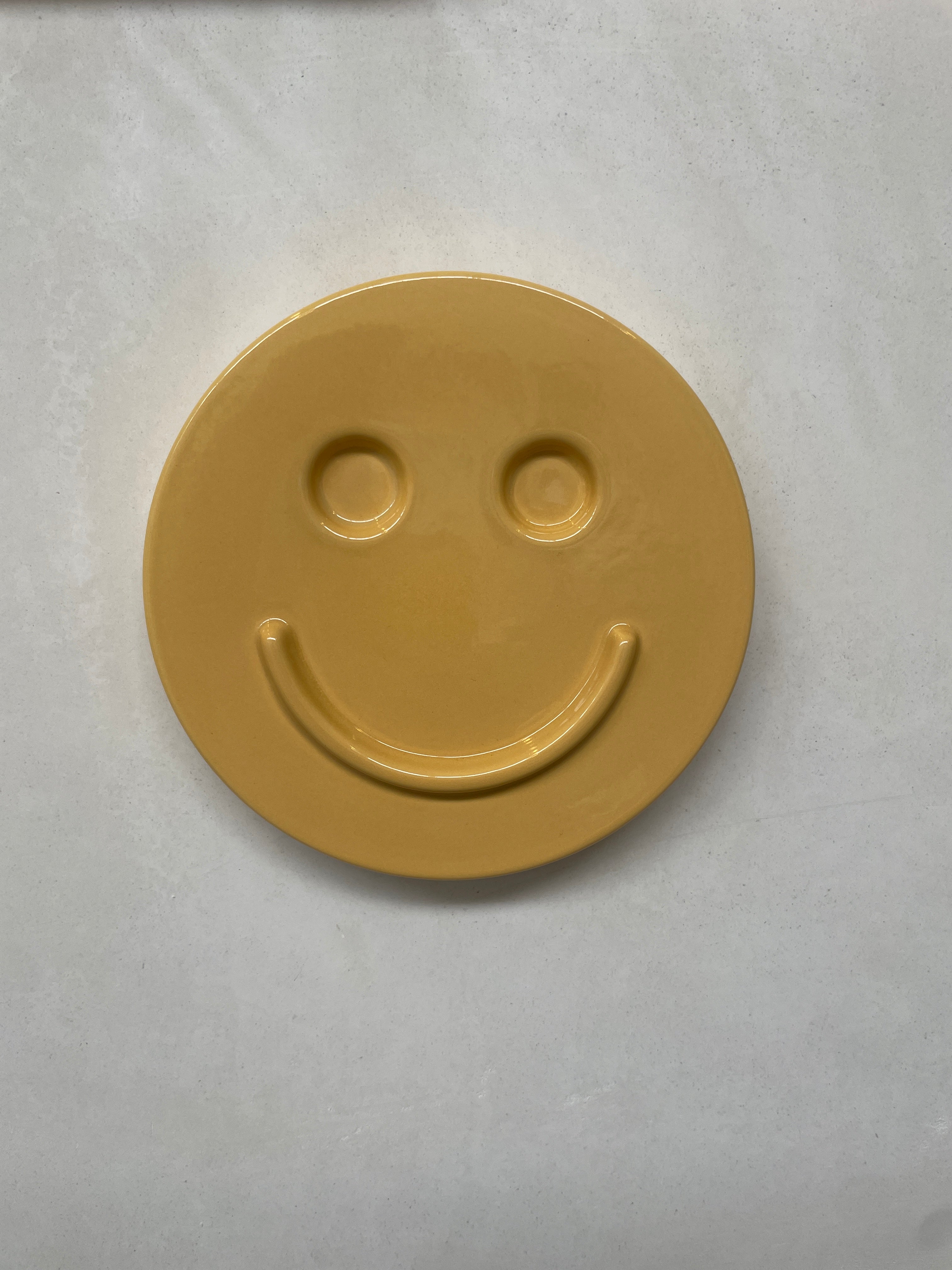 Yellow 'HAPPY' ceramic artwork