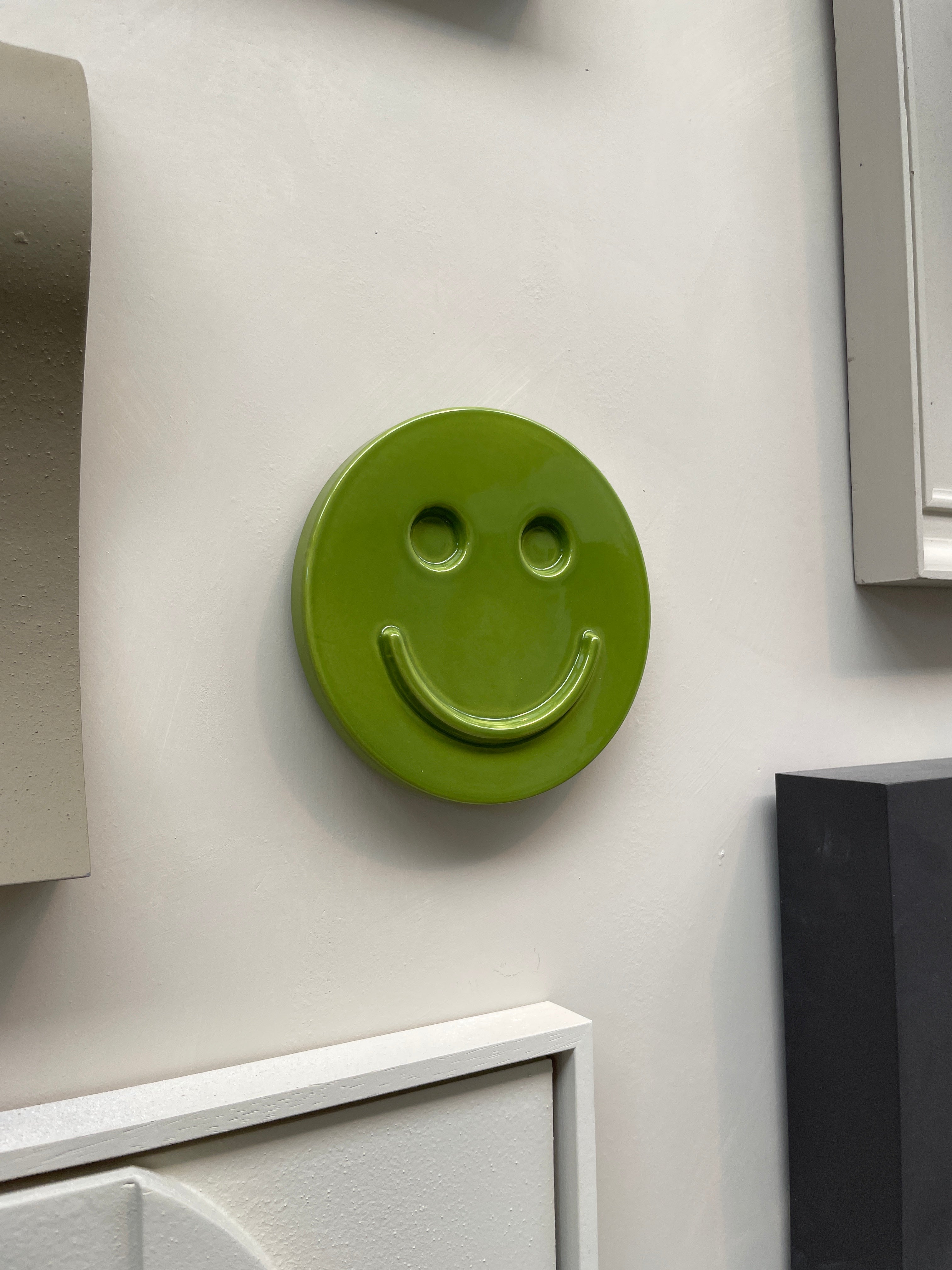 Green 'HAPPY' ceramic artwork