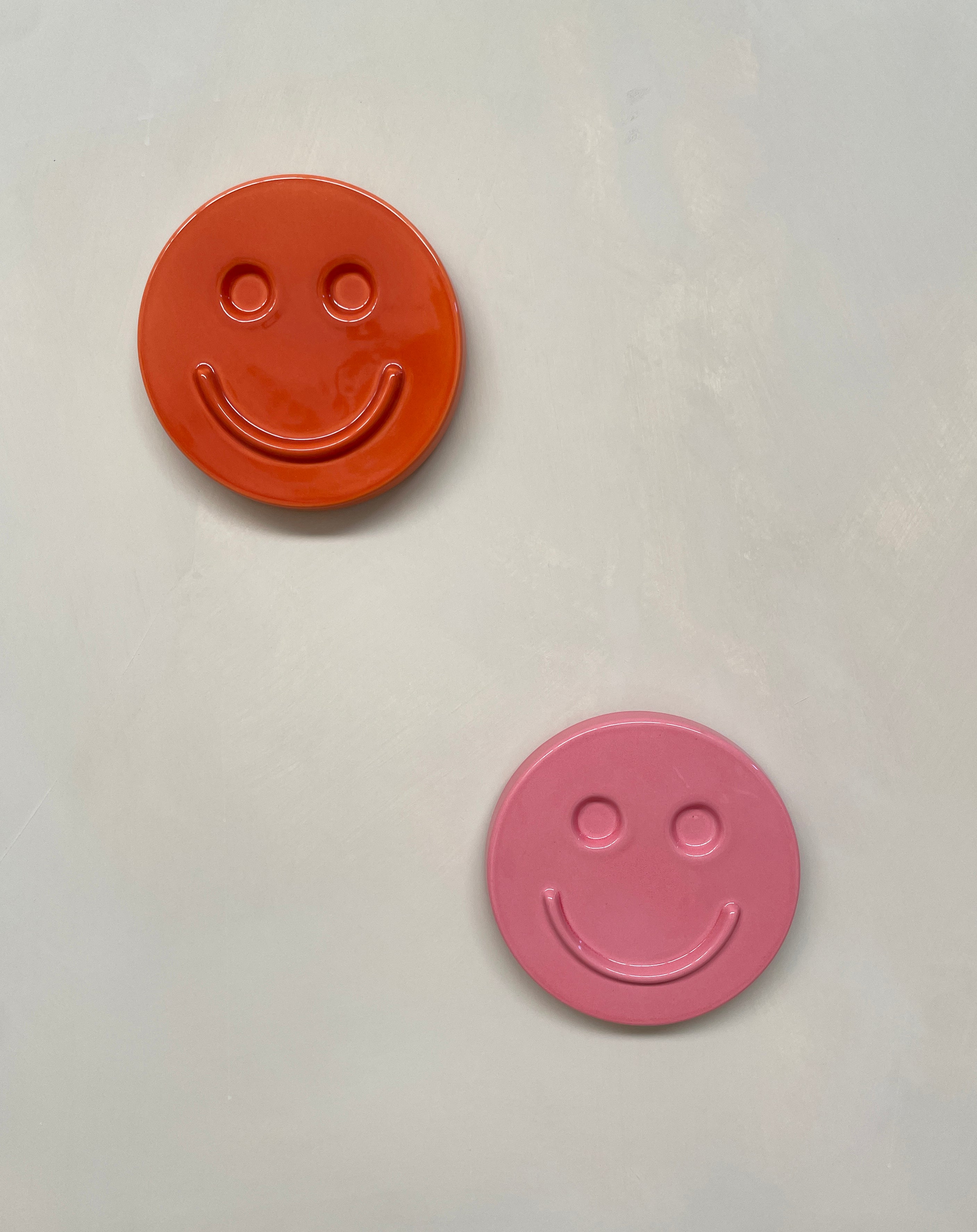 Orange 'HAPPY' ceramic artwork