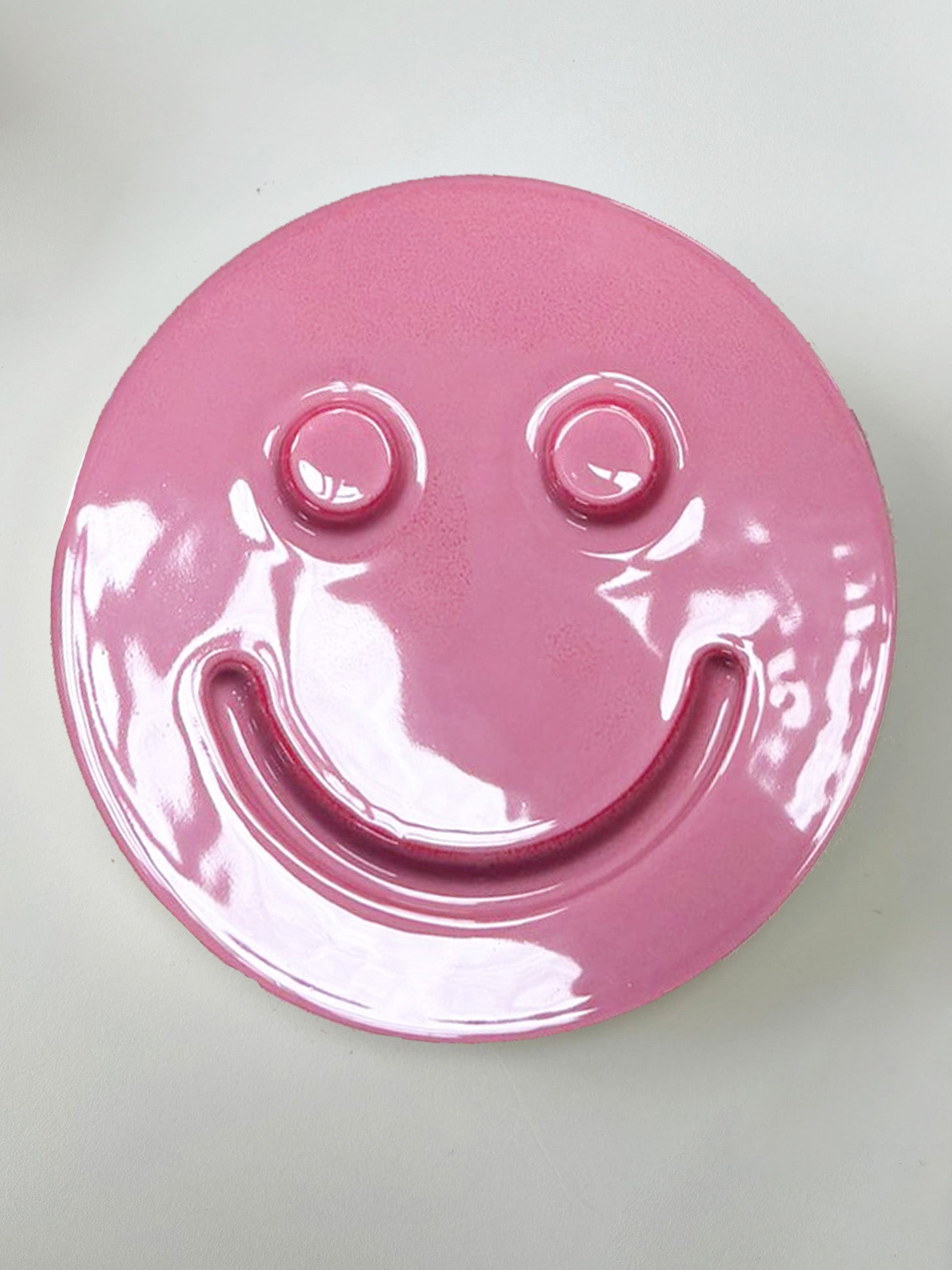 Pink 'HAPPY' ceramic artwork